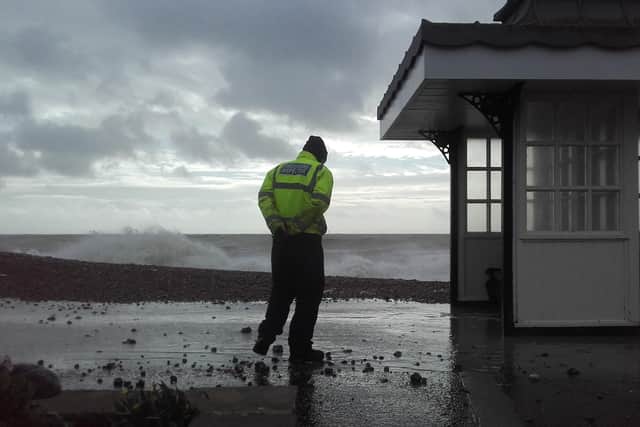 A foreshore inspector keeping an eye on things on Worthing seafront at high tide during Storm Ciara