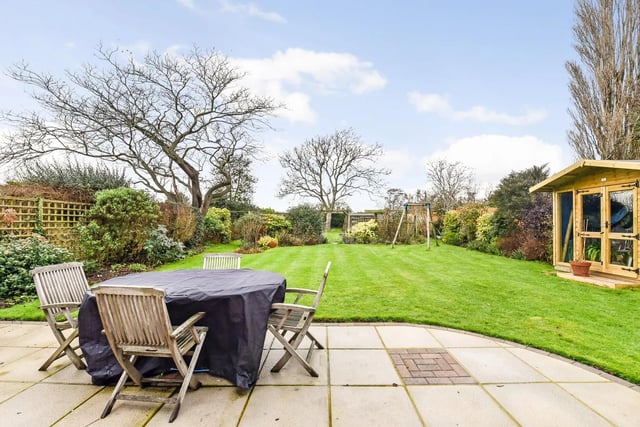 At 120 feet deep, the rear garden has beautifully defined borders and plenty of privacy.