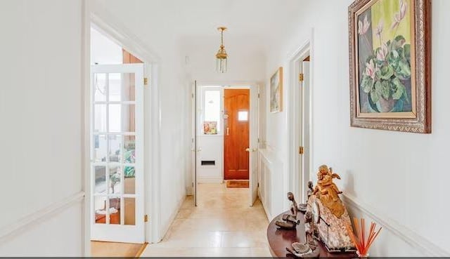 The front door leads to an  entrance porch with door to the hall.