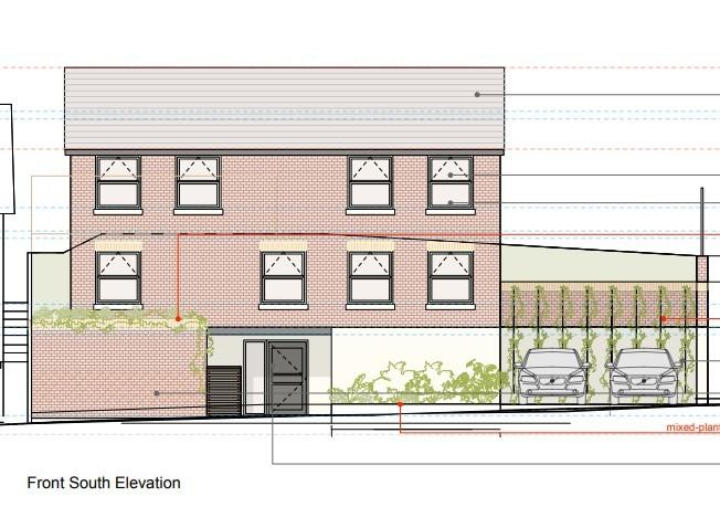 A plan to build a house in place of a garage block in Hastings has been approved by councillors