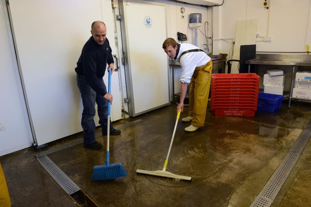 Cleaning up at Aglaia Seafoods after flooding at Riverside Industrial Estate Littlehampton, on Friday, December 6, 2013