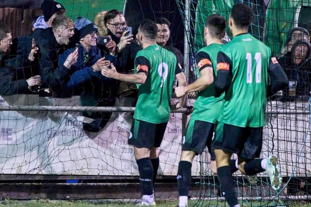 Dan Perry and team-mates celebrate one of his strikes v Chichester City with the Hill fans | Picture: Chris Neal
