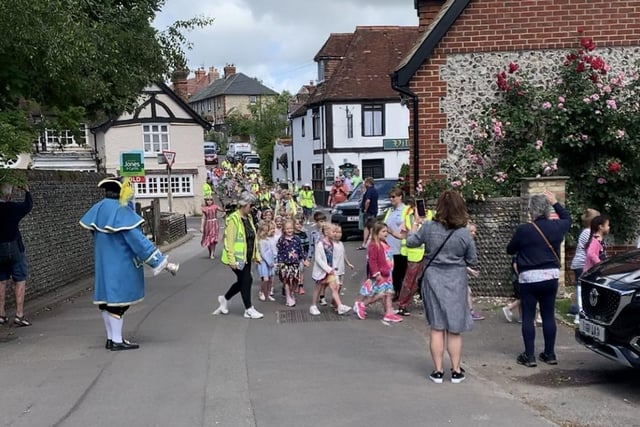 Findon Village Summer Revels started with a procession to Pond Green for the children to perform traditional country dancing, followed by maypole dancing back at St John the Baptist School