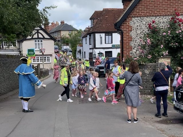 Findon Village Summer Revels started with a procession to Pond Green for the children to perform traditional country dancing, followed by maypole dancing back at St John the Baptist School
