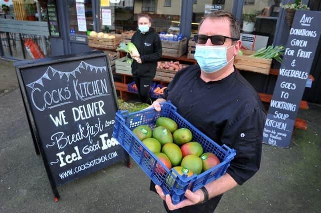 Jason Earl, owner of Cocks Kitchen in Worthing, made 35 meals a day for Worthing Soup Kitchen and gave out fruit and vegetables in front of the restaurant. Photo: Steve Robards SR2102112