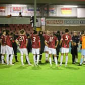 Lewes players and staff after their penalty shootout defeat to Bognor in the FA Trophy | Picture: James Boyes