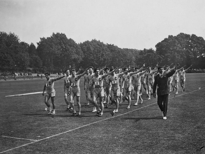 The French team saluting on the parade ground at Preston Park in Brighton before an International Athletics contest against England, circa 1925.