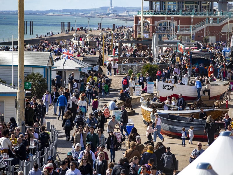 People enjoy the spring sunshine this Good Friday on Brighton seafront in East Sussex.