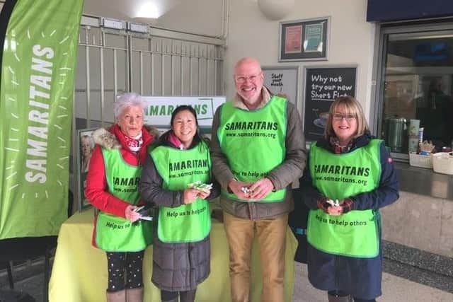 Worthing Samaritans volunteers handing out free tea at Worthing Railway Station for Brew Monday