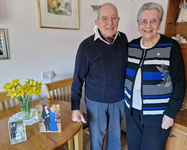 Jeff and Jean Whittington with their 65th wedding anniversary card from the King and 50th wedding anniversary card from the Queen. Picture: Elaine Hammond / SussexWorld