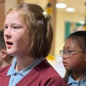 Children singing for residents