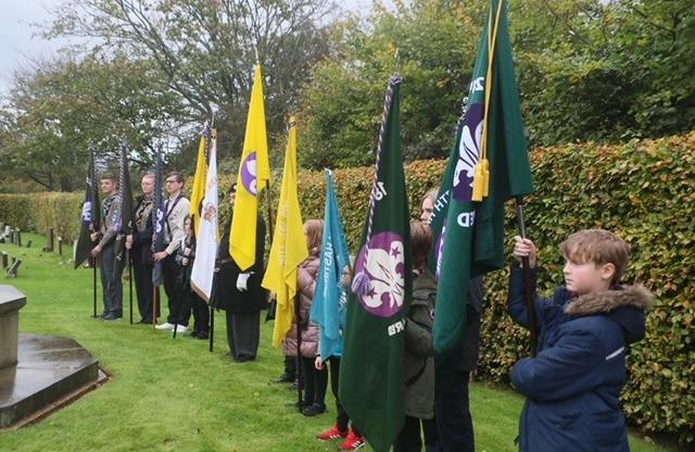 Scouts present standards at the service