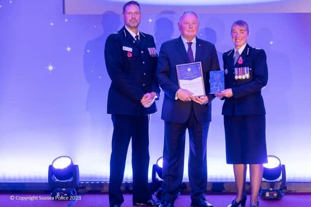 Volunteer of the Year Malcolm Flavell collecting his award. Picture: Sussex Police