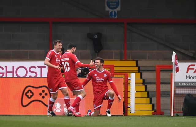 Jordan Tunnicliffe celebrates with teammates Tony Craig and Ashley Nadesan after scoring their team's third goal during the FA Cup Third Round match between Crawley Town and Leeds United at The Peoples Pension Stadium on January 10, 2021