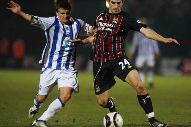 Dean Cox battles Ched Evans for Brighton and Hove Albion in 2008. (Photo credit should read GLYN KIRK/AFP via Getty Images)