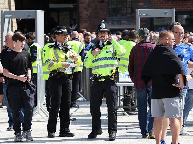 Police officers stand on duty as they work outside the Hill Dickinson Stadium, the new home ground of Everton football club, ahead of the English Premier League football match between Everton and Brighton and Hove Albion