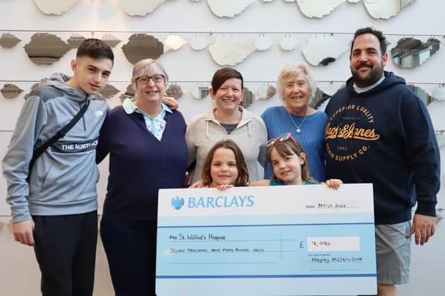 Hayley with Bev’s family when they presented the cheque.