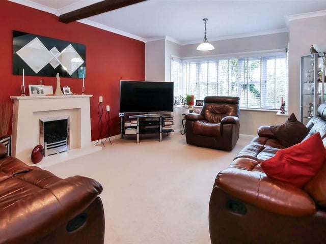 The living room at the front of the property is spacious
