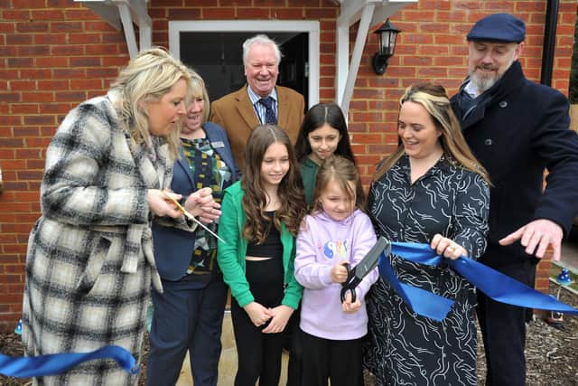 Mid Sussex MP Mims Davies and Mid Sussex District Councillor Robert Salisbury with the homeowners at the opening of the homes