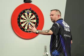 Hastings ace Ritchie Edhouse suffered a first-round defeat in the Cazoo World Darts Championship.