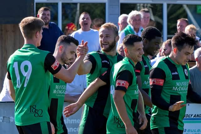 Burgess Hill players and fans celebrate another strike v Stansfeld | Picture: Chris Neal