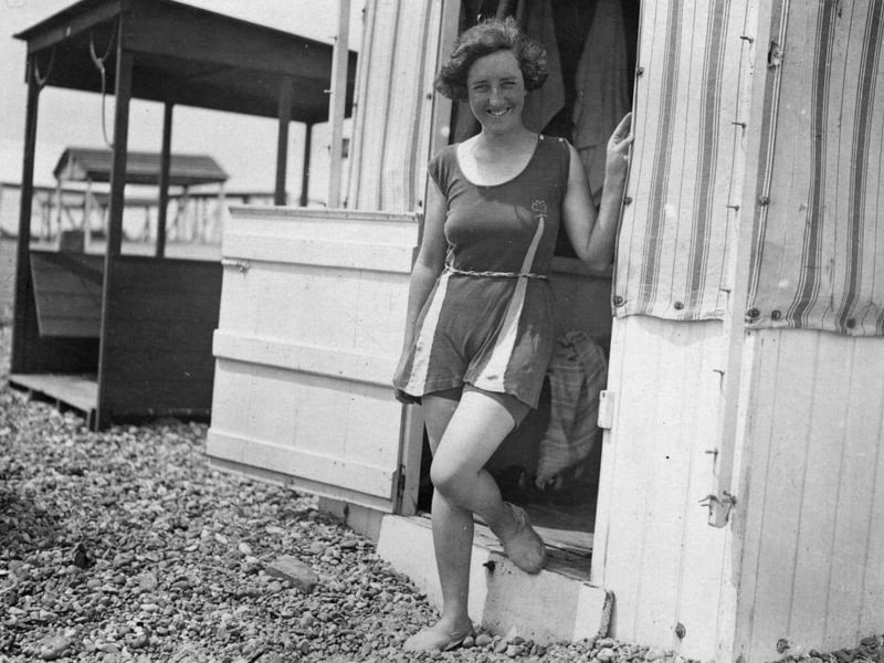 Argentine swimmer Lillian Harrison, in training to swim the English Channel, is pictured outside her bathing hut on the beach at Hove, circa 1925.