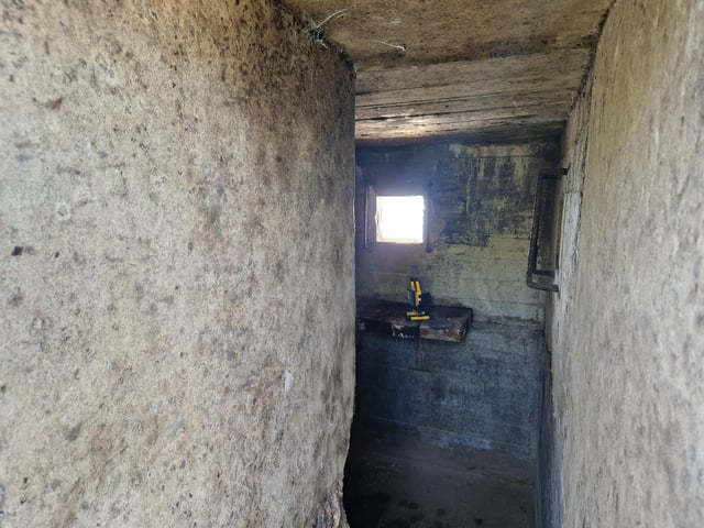 Pete Coe, one of the project leaders, and fellow former Royal Engineer Graham Cosham worked together to open the southern embrasure at the Ferring pillbox