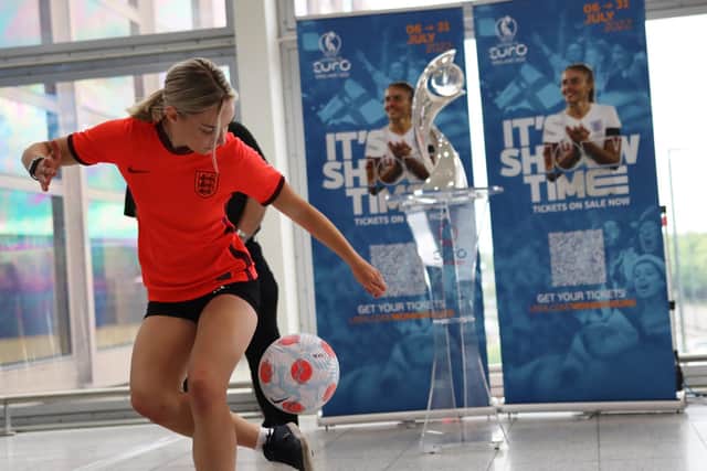 Shannan Ghee shows off her skills in front the UEFA Womens Euro trophy