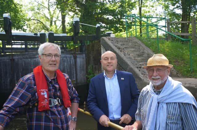 Andrew Griffith pictured with John Reynolds (left), director of boat operations and also conservation adviser, and Peter Winter (right), deputy secretary and also editor of the volunteer newsletter.