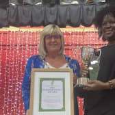 Annet Ziraba is presented with the Parishioners' Award by Rustington Parish Council chairman Mrs Alison  Cooper