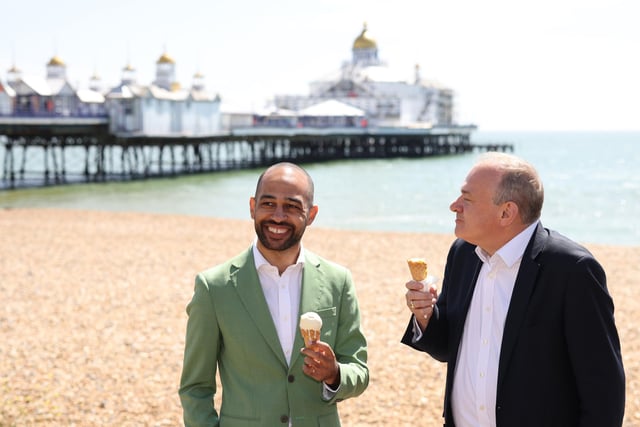 EASTBOURNE, ENGLAND - MAY 24: Liberal Democrat leader Ed Davey with Liberal Democrat candidate Josh Babarinde enjoy an ice cream during a visit to the marginal seat of Eastbourne on May 24, 2024 in Eastbourne, England. The Liberal Democrats are targeting Conservative marginal seats along the South Coast in the upcoming general election on July 4th.  (Photo by Dan Kitwood/Getty Images)