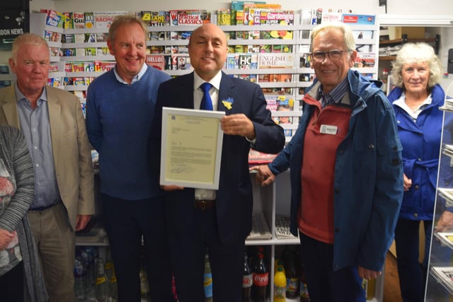 Arundel & South Downs MP Andrew Griffith meets volunteers at Findon Village Store and Post Office and congratulates them on winning the Queen's Award for Voluntary Service