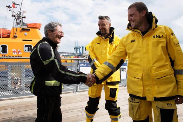 Rescued Dermot Ryan thanks Newhaven RNLI's Lewis Arnold and Chris Glasspool