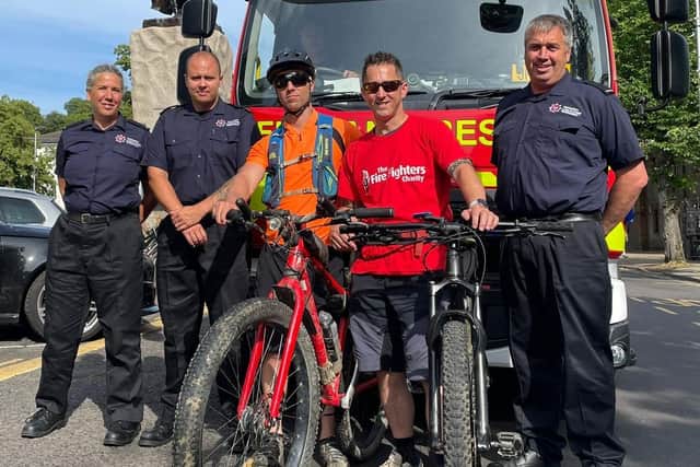 Horsham Black Watch manager Jamie Cox and East Sussex Fire & Rescue Service watch manager Duncan Thomson pedalled all 100 miles of the South Downs Way overnight in memory of two former colleagues. Photo contributed