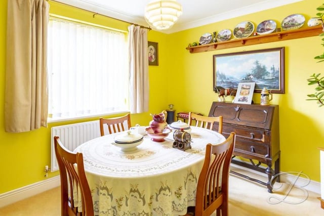 The dining room is a quaint part of the Spindle Court house, offering more space for hosting or simply a quiet corner for family meals. It has a carpeted floor, central heating radiator and a window facing the front.