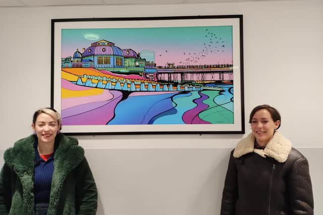 Jemma and Stella with their artwork at the CDC