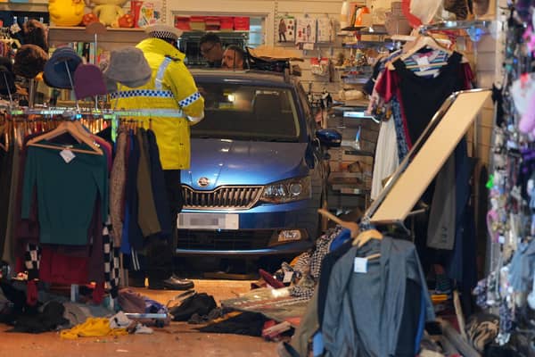 A car has collided with a charity shop in Chichester.