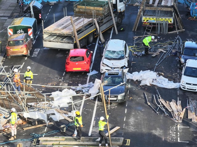 Everyone escaped unharmed after scaffolding collapsed onto a road in Hove – with clear-up works continuing the next day.