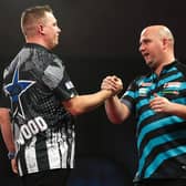 Rob Cross congratulates Chris Dobey at the end of their last-16 clash at Alexandra Palace | Picture: Kieran Cleeves-PDC