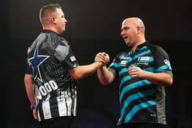 Rob Cross congratulates Chris Dobey at the end of their last-16 clash at Alexandra Palace | Picture: Kieran Cleeves-PDC