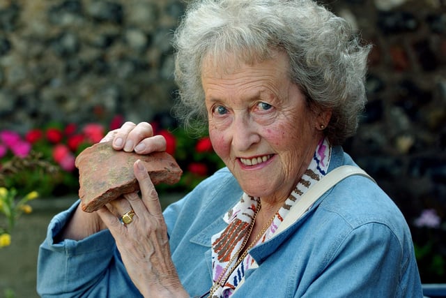 Pearl Millard with a Roman tile she took in to Manor Cottage