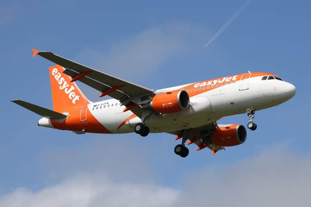 An easyJet aircraft flying at more than 300mph over the Sussex countryside missed a suspected drone by as little as 16ft, an official report has confirmed. Picture by Hollie Adams/Getty Images
