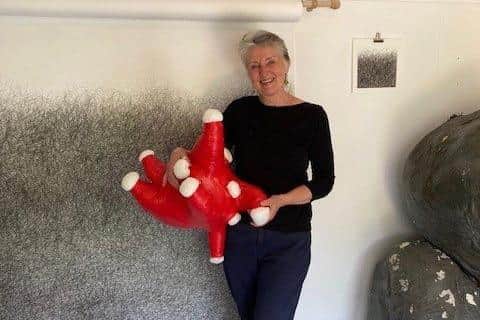 Artist Judith Alder with one of her fun creations
