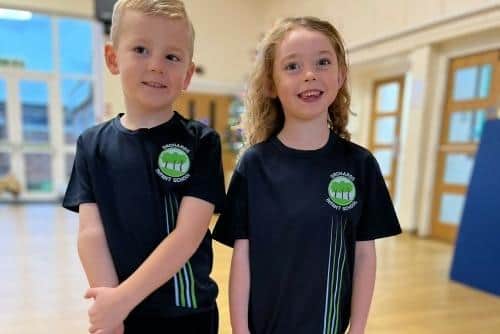 As well as new uniforms, the schools will introduce new PE t-shirts. (Pictured are pupils Lucas and Poppy). Photo contributed