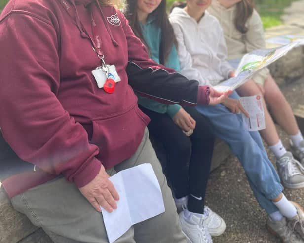 Mrs Walton helping with the orienteering.