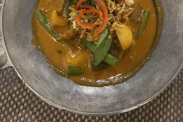 Pictured is the Cosy Christmas Chestnut Red Curry. It's a meatless chicken alternative with mixed peppers, coconut tips and water chestnuts. It's gently spiced coconut red curry sauce topped with line leaf, sliced red pepper and fried shallots.