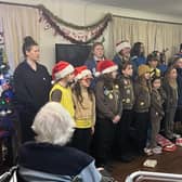 Rainbows, Brownies and Guides singing for residents at Mountside Care Home.