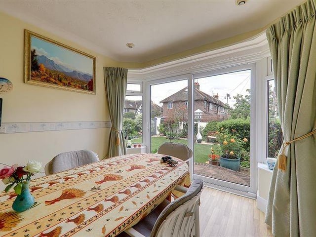 Double-glazed sliding patio doors lead to garden