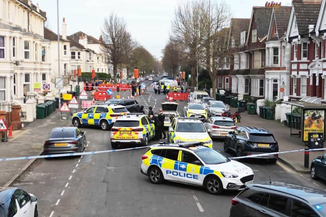 Photos show major police response and armed officers in Hove
