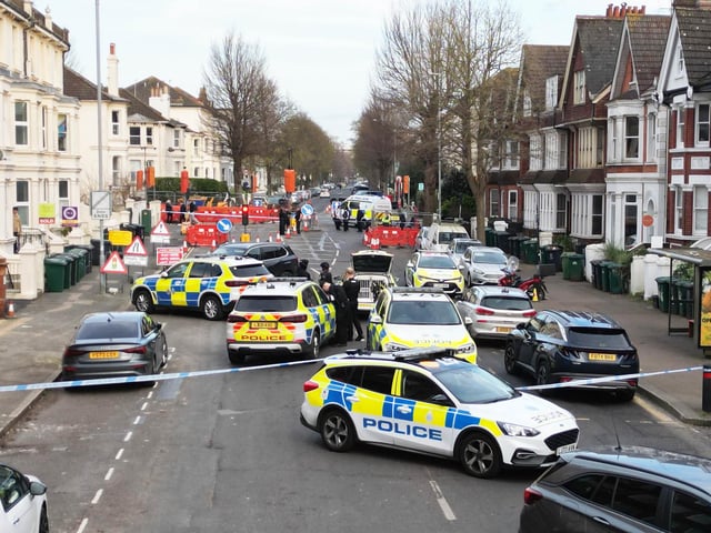 Photos show major police response and armed officers in Hove